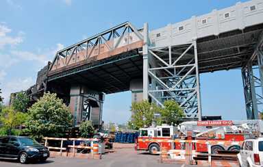 Ouch! Scaffolding plummets several stories onto worker