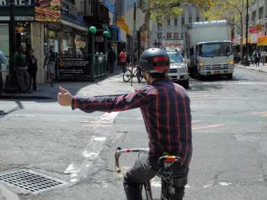 Signal ahead! Bikers should have been taught this in pre-school