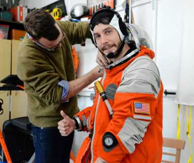 Circuit Lord in space! Reporter tries on space suit made at the Navy Yard