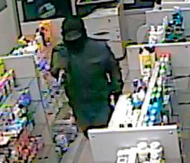 Cops seek gunman for drug store robbery