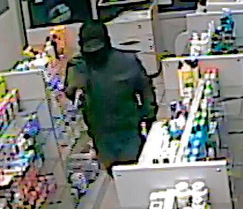 Cops seek gunman for drug store robbery