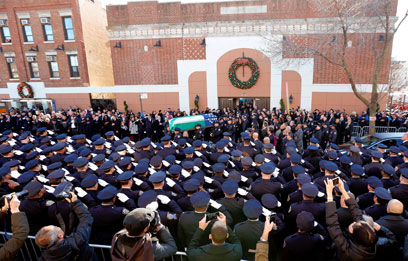 Officers stage silent protest at Ramos funeral