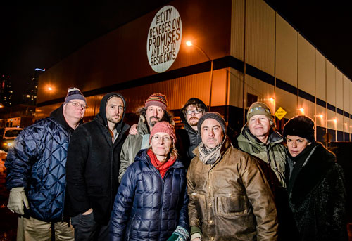 Their rage in lights! Activists illuminate building to protest city’s broken park promise