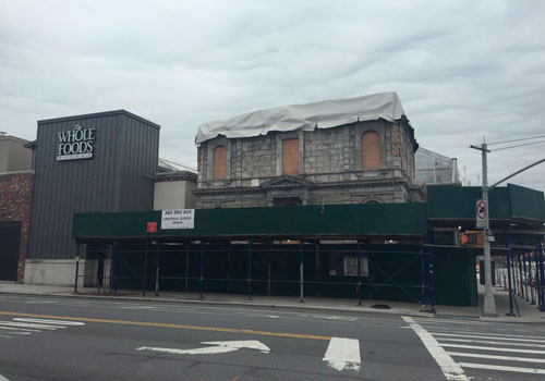 Back in gray! Coignet building’s original facade revealed