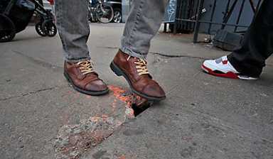 Hole in one! Beford Ave. sidewalk a walker’s nightmare