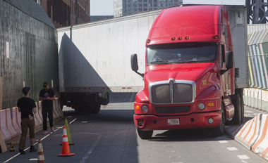 Truck slams into traffic-death memorial — as it goes up