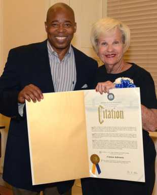 Senior volunteer saluted