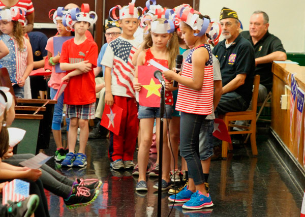 Flag philanthropy: Local biz donates star-spangled banners to school