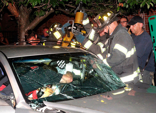 Firefighters cut open cars to rescue crash victims