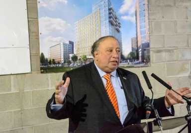 Top in the name of love: Developer caps off building named for wife