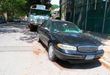 Abandoned car getting free ride in Mill Basin