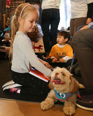 Kids read to dogs, maximum adorableness ensues