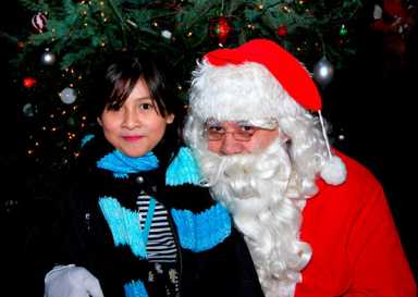 Mood lighting: Lady Moody Triangle tree illumination brings Christmas spirit despite heat wave