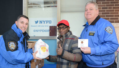 Run a-fowl of the law: Coney cops hand out Thanksgiving turkeys