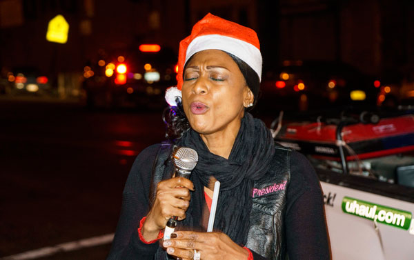 Crown Heights residents sing carols at gun violence hot spots