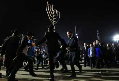All fired up! Grand Army Plaza menorah aflame for Hanukkah
