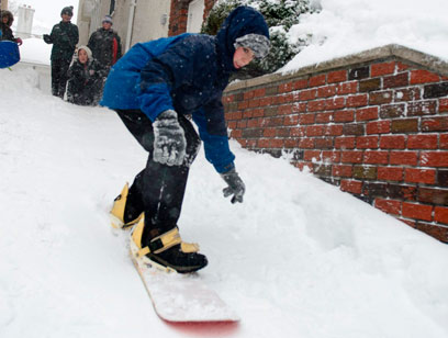Cowabunga! Brooklynites snowboard, ski, and sled through blizzard