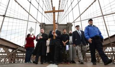 Holy strollers: Hundreds march across Brooklyn Bridge in Way of the Cross procession