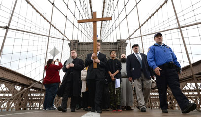 Holy strollers: Hundreds march across Brooklyn Bridge in Way of the Cross procession