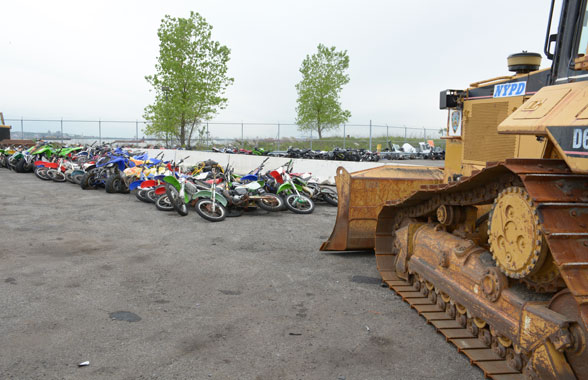 Truck yeah! Police crush dozens of illegal dirtbikes in Red Hook