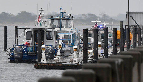 Police boats haul body found in harbor to Kingsborough