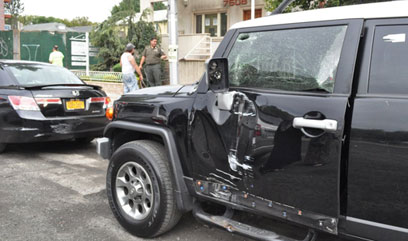 Two cars, garbage truck collide on Bay Parkway