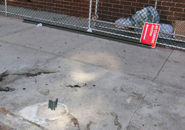 A bad sign? Someone keeps cutting ‘no standing’ sign in front of school
