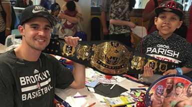 Tagging in: Nets guard, wrestling stars visit children’s hospital