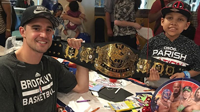 Tagging in: Nets guard, wrestling stars visit children’s hospital