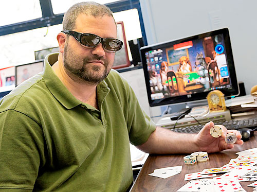 Poker face! Community board district manager has double life as a card shark