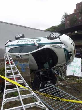 Fork it over: Vandals flip Parks Dept. car with Bobcat in Bridge Park