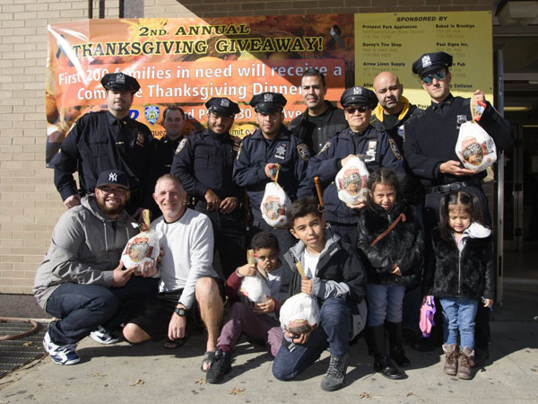 Copping a bird! Sunset Park police give out free turkeys