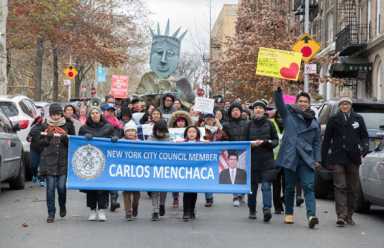 Signs of the times: Anti-Trump protestors storm Sunset Park