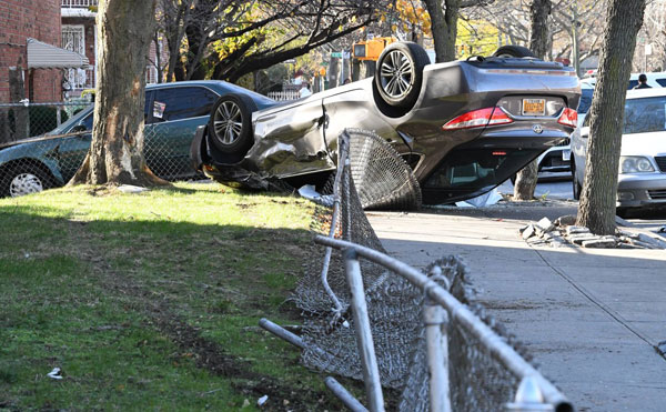 See it! Car flips into Flatlands front yard