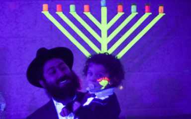The glows-en people: Beach Haven’s menorah glows in the dark!