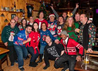 Fleece navidad! Ridgites show off ugly sweaters at Schnitzel Haus shindig