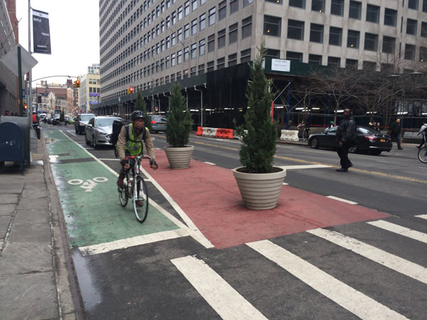 A rider pedals through the Jay Street bike lane.