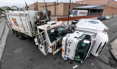 What the truck! Garbage hauler flips fellow four-wheeler