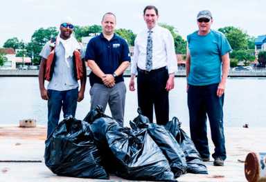 The city and Sheepshead Bay pol clean up the trash-filled bay