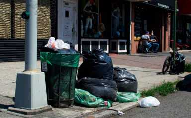 Bins laden: Corner trash cans overflowing in Ridge