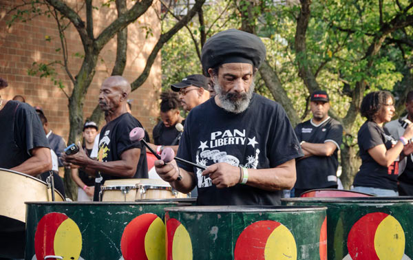 Sounds of serenity: Hippies and hip hop-lovers attend unity concert ahead of J’Ouvert