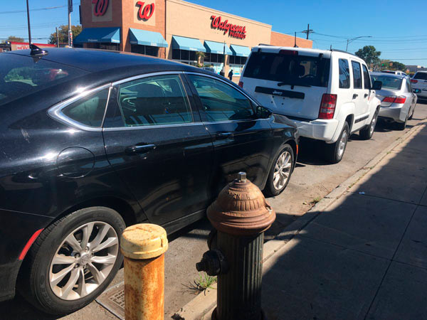 Locals blast Flatbush Avenue car dealer for filling street parking with rides for sale