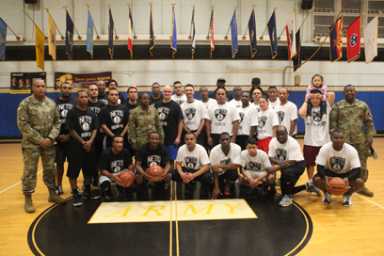 Brooklyn Nets players coach basketball game at Fort Hamilton.