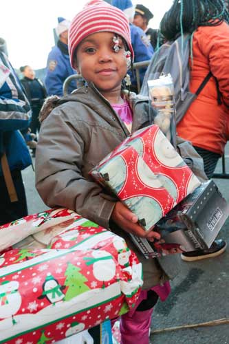 Blue goes red: North Brooklyn authorities join Santa to deliver toys to tots