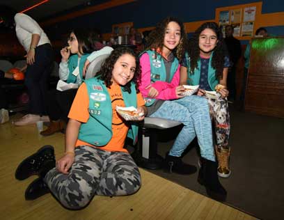 Money to spare! Local Girl Scouts raise thousands for hurricane victims at bowling fund-raiser
