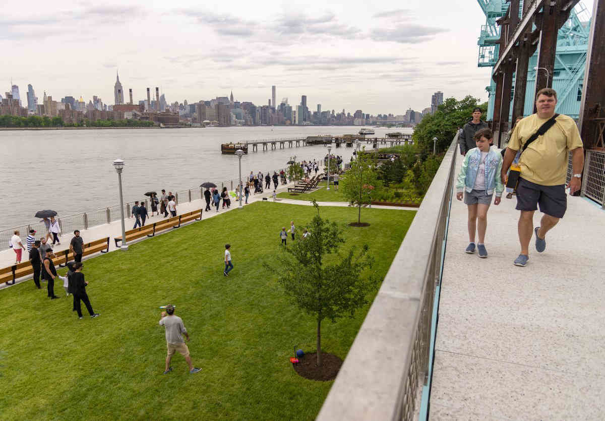 Picture of people walking at the Domino Park promenade