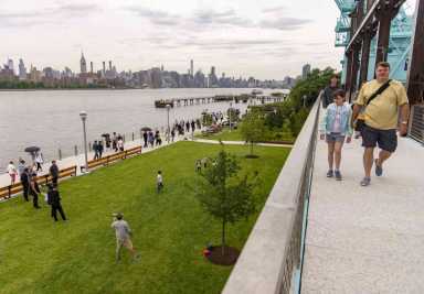 Picture of people walking at the Domino Park promenade
