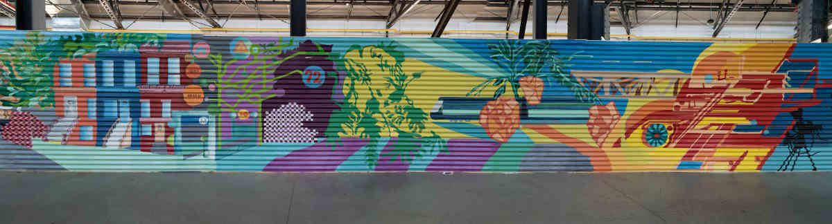 Sprucing up the Yard: Painters create public mural for waterfront commercial hub