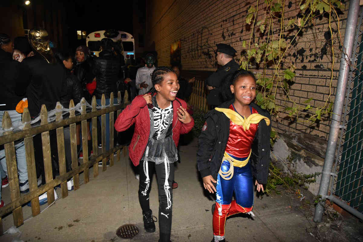 To protect and unnerve: Bushwick cops thrill kids with haunted station house