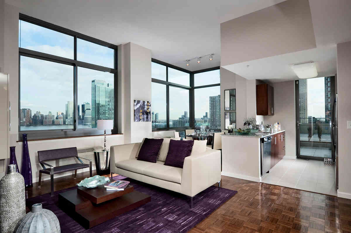 High-rise on Jersey City waterfront features outdoor pool with city views